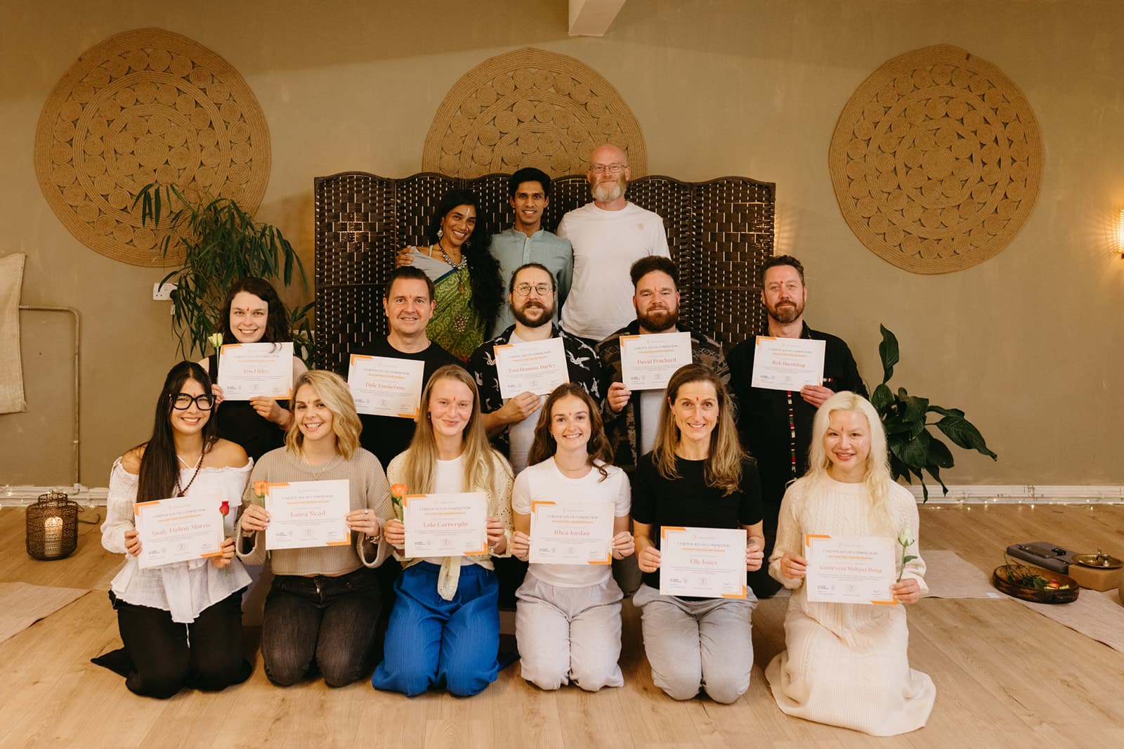 The teacher training graduates and their teachers gathered with certificates