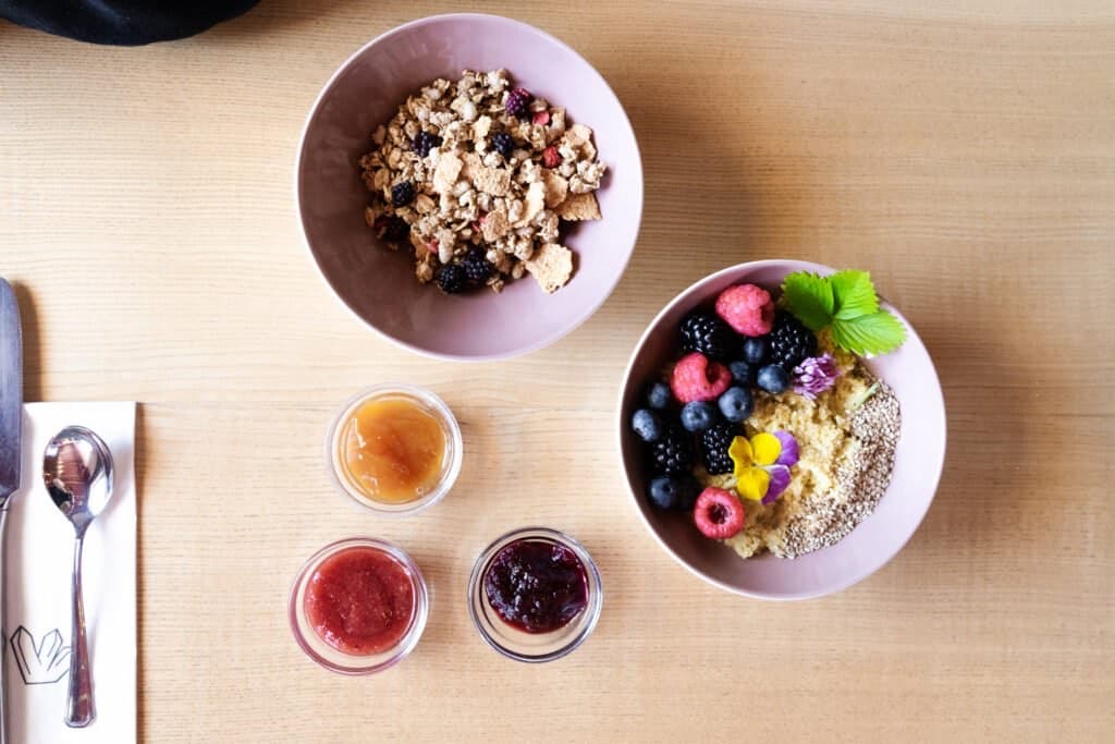 Breakfast bowls of fruit and granola