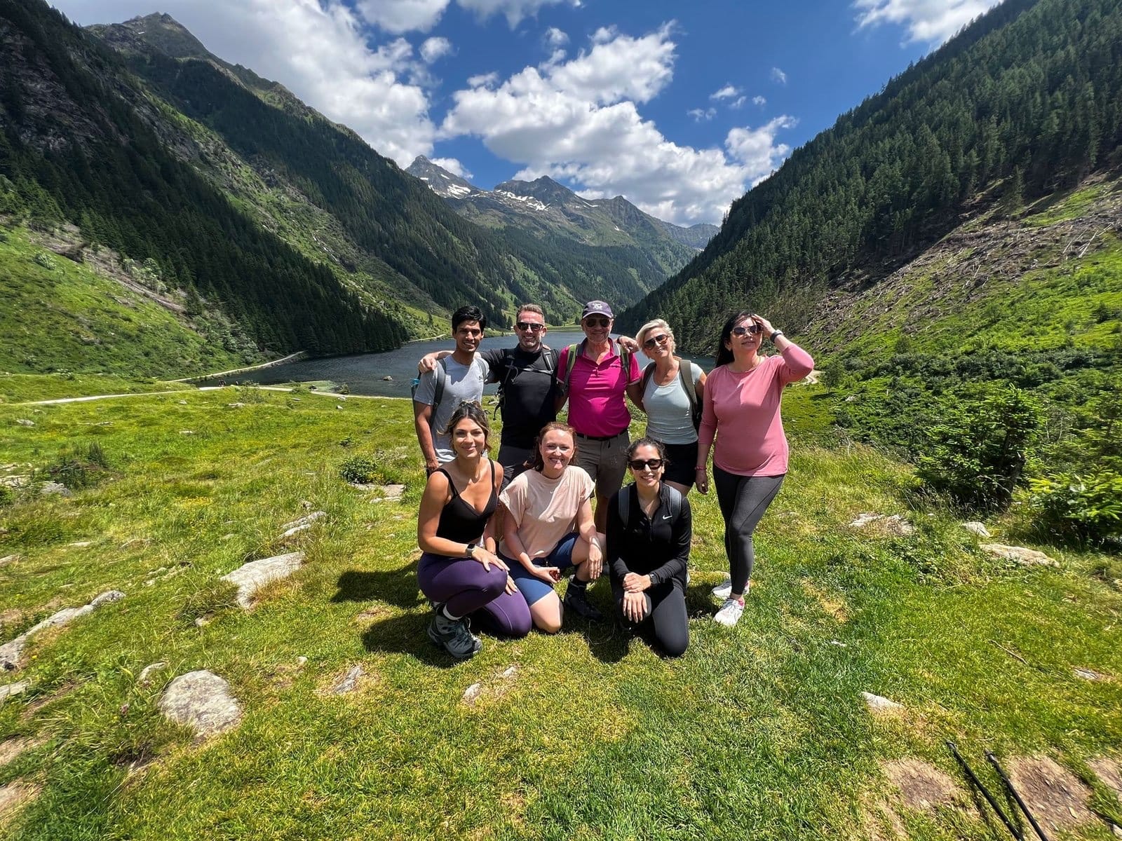 The retreat group together on a mountain meadow